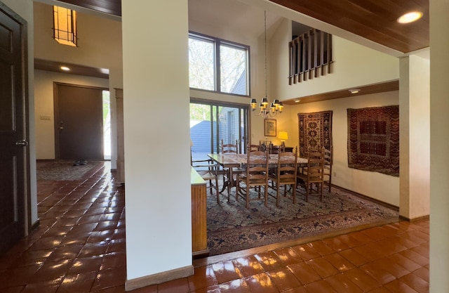 6 Crocus Ln, North Oaks, MN 55127 - dining space featuring a towering ceiling, a chandelier, tile patterned flooring, and recessed lighting