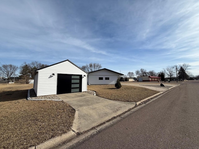 exterior space with concrete driveway