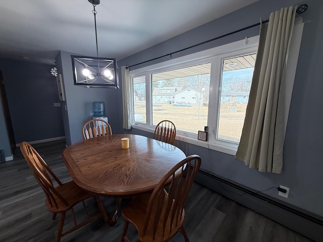 dining room with a baseboard radiator, baseboards, an inviting chandelier, and dark wood-style flooring