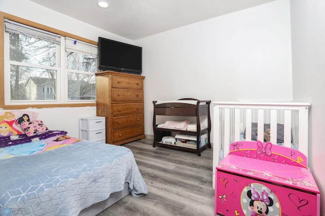 bedroom featuring wood finished floors