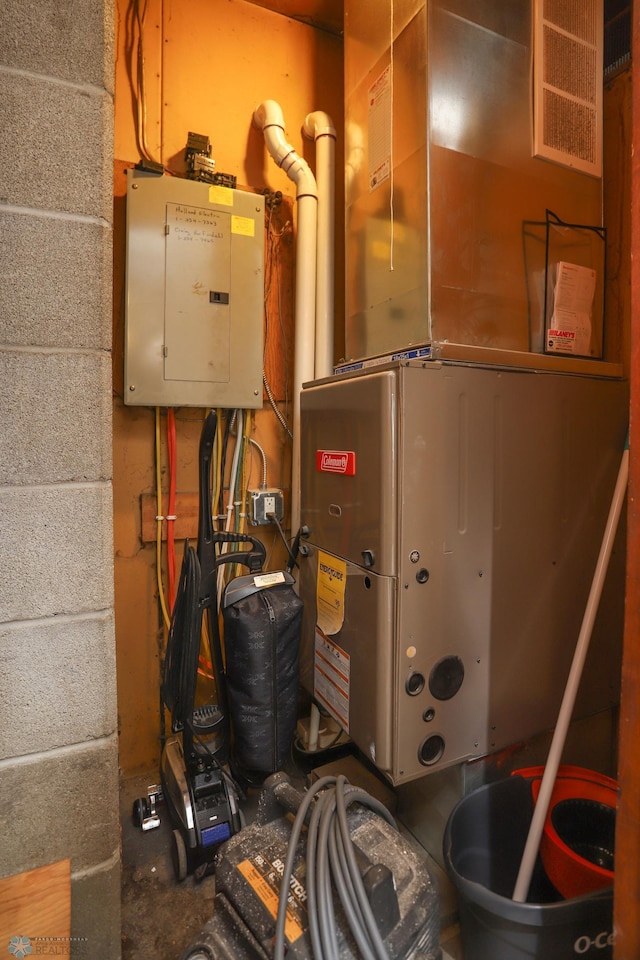 utility room featuring heating unit