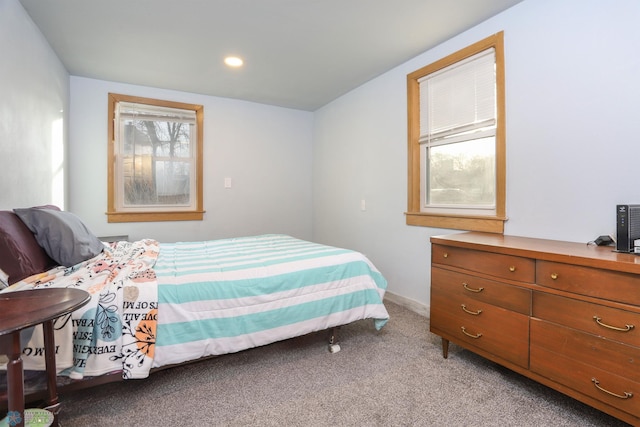 bedroom featuring recessed lighting, baseboards, and light carpet