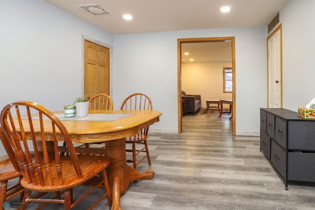 dining area featuring recessed lighting, visible vents, and light wood-style flooring