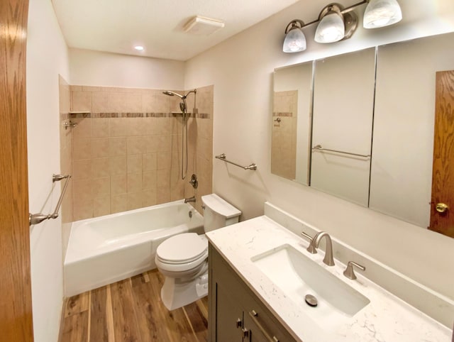 full bathroom with toilet, vanity, bathtub / shower combination, and wood finished floors