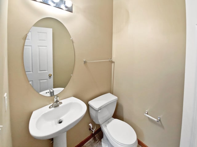 bathroom with a sink and toilet