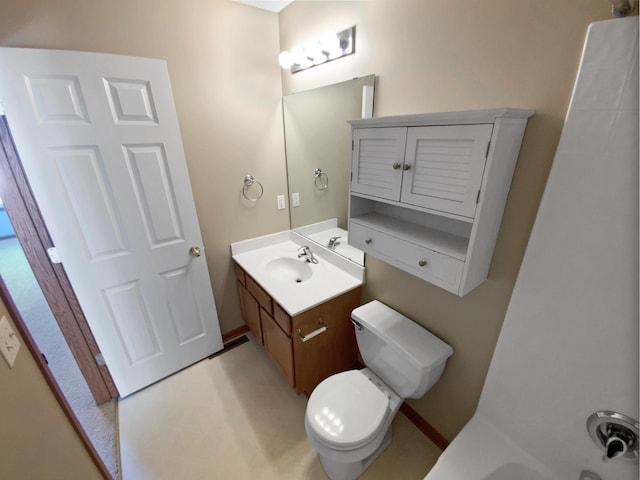 bathroom featuring toilet and vanity