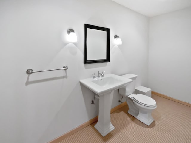 2412 132nd Ave NE, Blaine, MN 55449 - bathroom with toilet and baseboards
