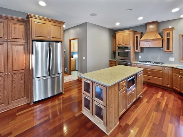 2412 132nd Ave NE, Blaine, MN 55449 - kitchen with dark wood-style flooring, recessed lighting, stainless steel appliances, and premium range hood