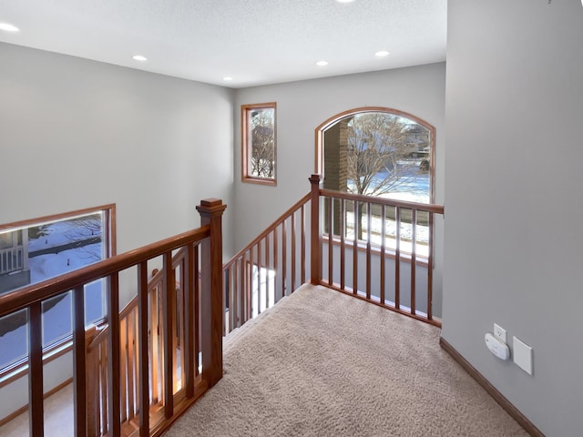 2412 132nd Ave NE, Blaine, MN 55449 - hall featuring baseboards, carpet floors, an upstairs landing, recessed lighting, and a textured ceiling