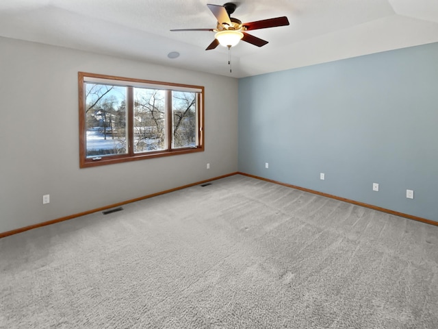2412 132nd Ave NE, Blaine, MN 55449 - unfurnished room with visible vents, baseboards, light colored carpet, lofted ceiling, and a ceiling fan