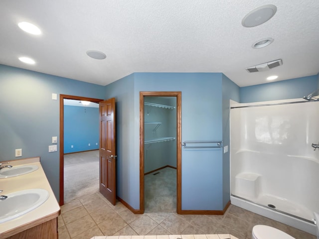 2412 132nd Ave NE, Blaine, MN 55449 - bathroom with a shower stall, visible vents, and a sink