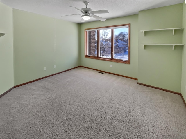 2412 132nd Ave NE, Blaine, MN 55449 - interior space with visible vents, a textured ceiling, baseboards, and carpet floors