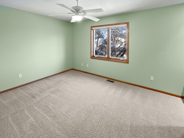 2412 132nd Ave NE, Blaine, MN 55449 - empty room featuring visible vents, carpet flooring, a textured ceiling, and baseboards