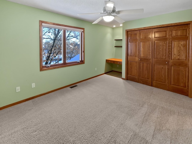 2412 132nd Ave NE, Blaine, MN 55449 - unfurnished bedroom featuring visible vents, baseboards, carpet floors, and a closet