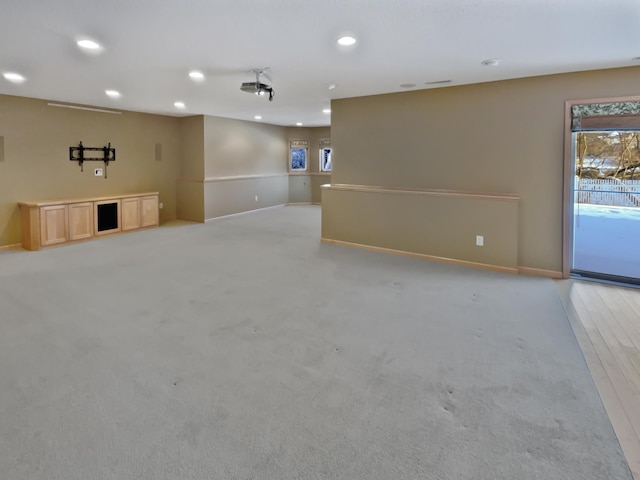 2412 132nd Ave NE, Blaine, MN 55449 - unfurnished living room with recessed lighting, light colored carpet, and baseboards