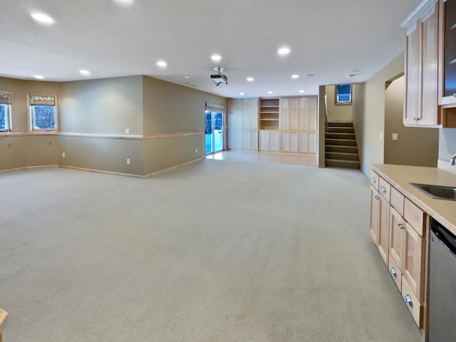 2412 132nd Ave NE, Blaine, MN 55449 - unfurnished living room with a sink, stairway, light colored carpet, and recessed lighting