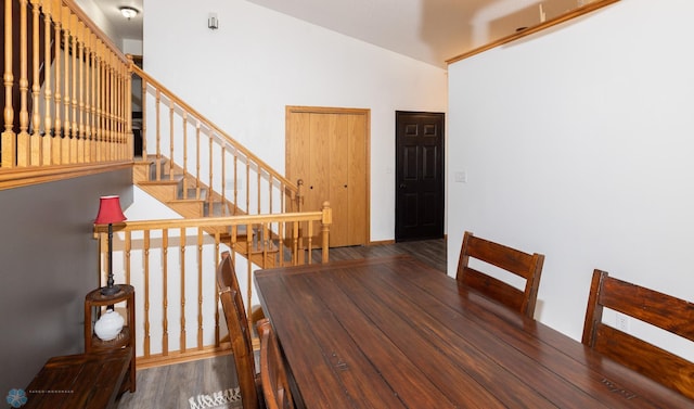 unfurnished dining area with stairs and wood finished floors