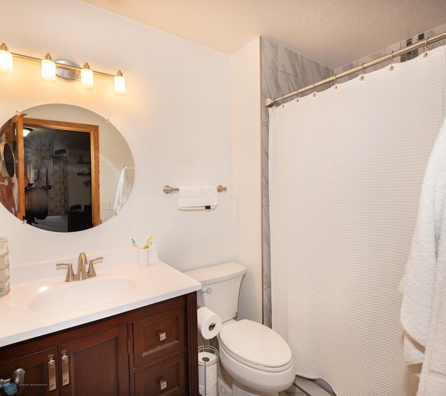 full bath with curtained shower, toilet, vanity, and a textured ceiling