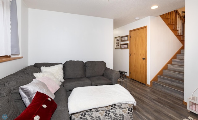 living area featuring dark wood-style floors, stairway, and recessed lighting