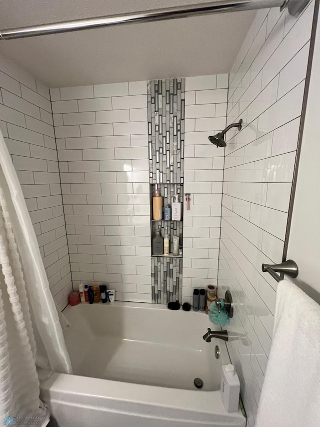 bathroom with shower / bathtub combination with curtain