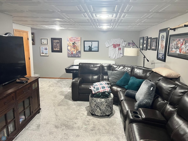 living room featuring baseboards and carpet