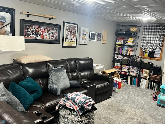 cinema room featuring carpet flooring and an ornate ceiling