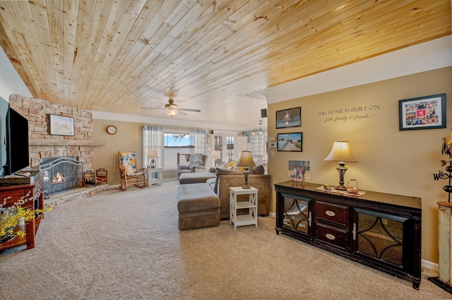 living area with baseboards, a fireplace, ceiling fan, wooden ceiling, and carpet flooring