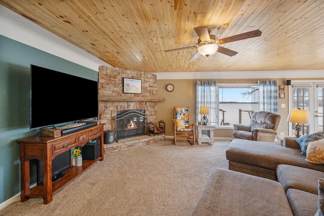 living room featuring a fireplace, carpet flooring, wood ceiling, and baseboards