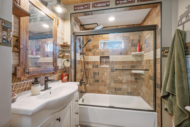 bathroom featuring backsplash, vanity, tile walls, and shower / bath combination with glass door