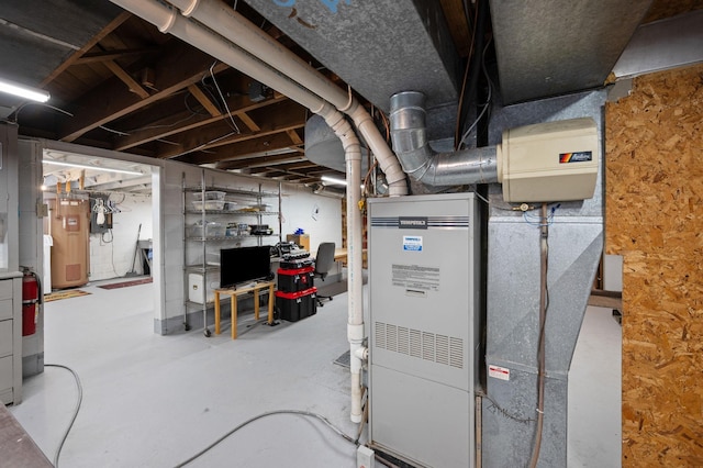 utility room with water heater