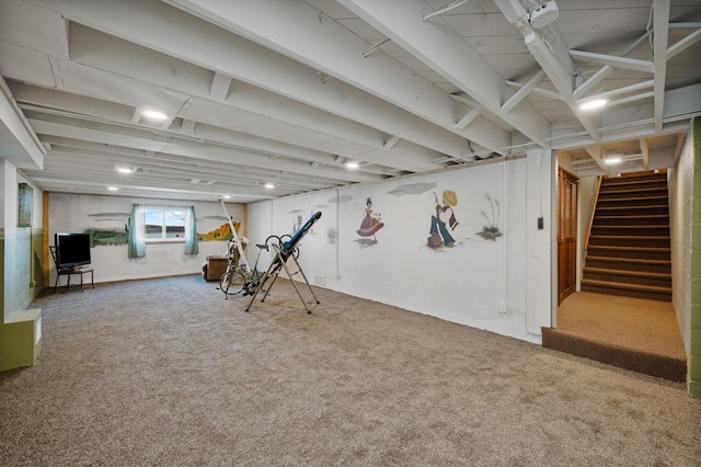 basement featuring carpet flooring and stairs