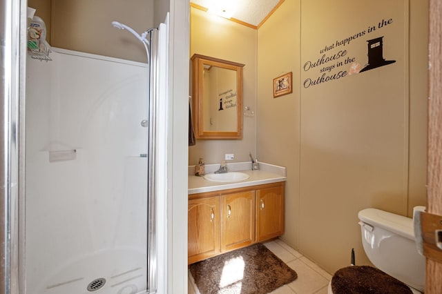 full bath featuring tile patterned floors, vanity, a shower stall, and toilet