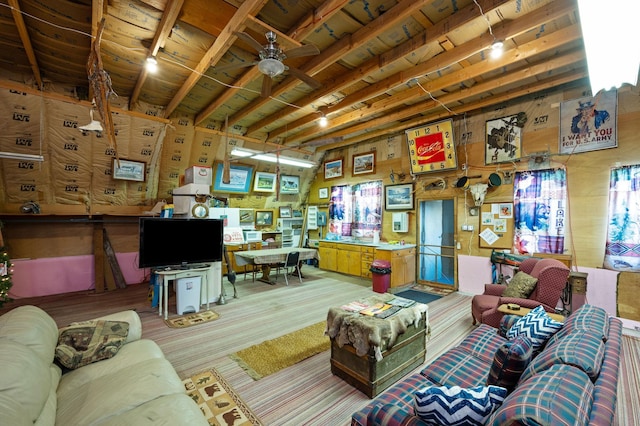 living area with wooden ceiling and a ceiling fan