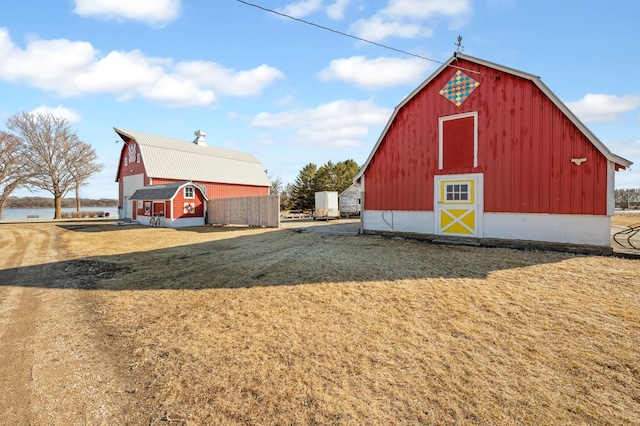 view of barn featuring a lawn