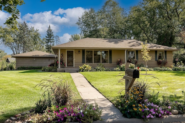 ranch-style house featuring a front lawn