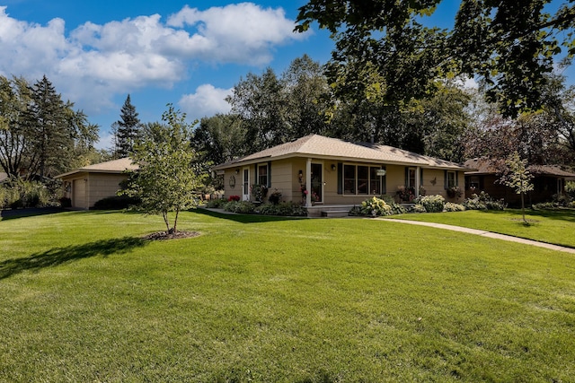 ranch-style house with a garage and a front yard