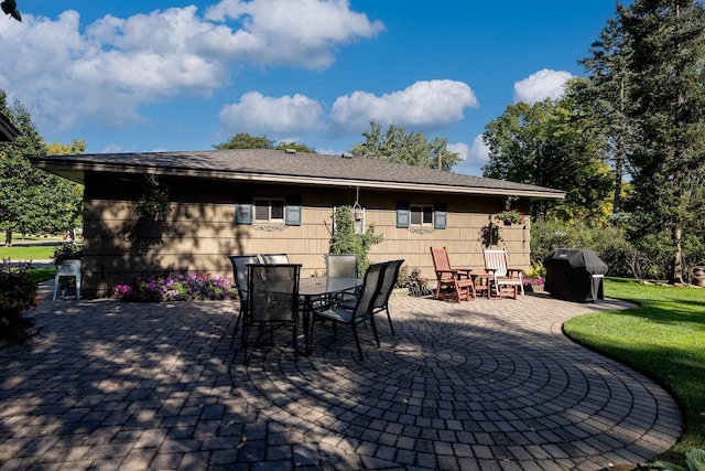 view of patio featuring area for grilling and outdoor dining area