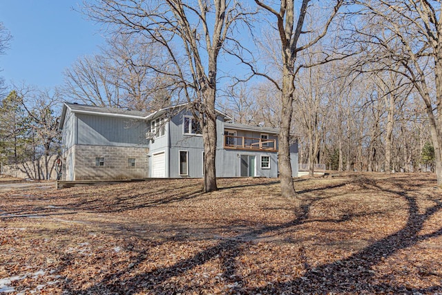 view of side of home with an attached garage