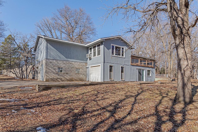 back of property featuring a garage