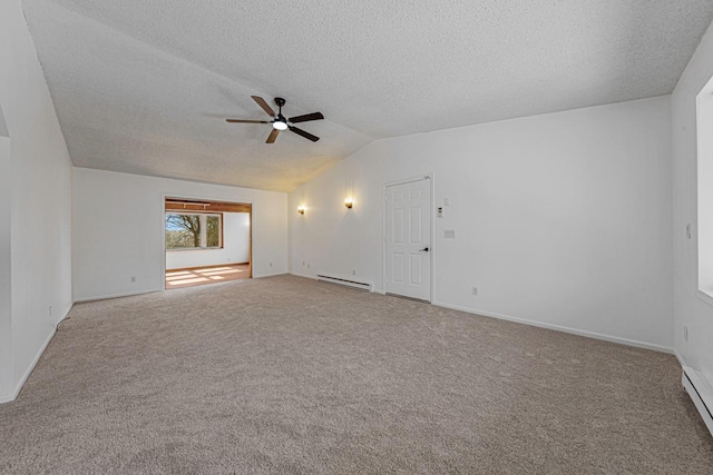 carpeted spare room featuring a baseboard heating unit, a textured ceiling, a ceiling fan, and vaulted ceiling