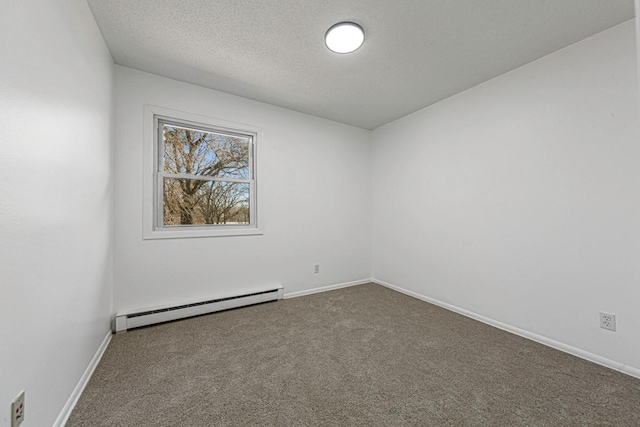 empty room featuring a baseboard heating unit, carpet floors, a textured ceiling, and baseboards