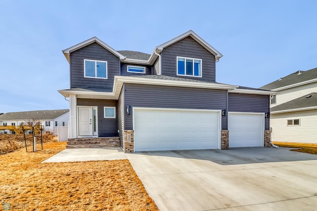 view of front of home featuring driveway and an attached garage