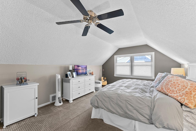 bedroom with light carpet, a ceiling fan, a textured ceiling, baseboards, and vaulted ceiling