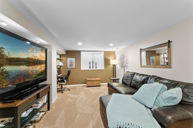 carpeted living area featuring recessed lighting and baseboards