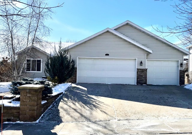 exterior space with driveway and an attached garage