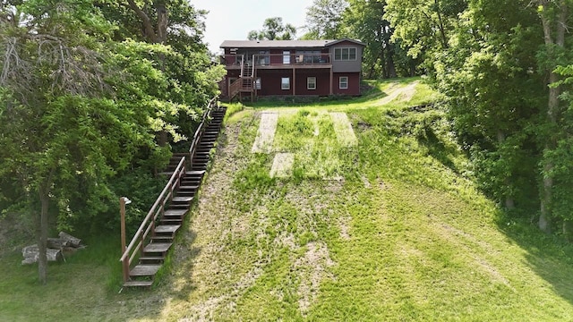 28887 Hi Vista Dr, Otter Tail Twp, MN 56515 - view of grassy yard with stairs and a deck