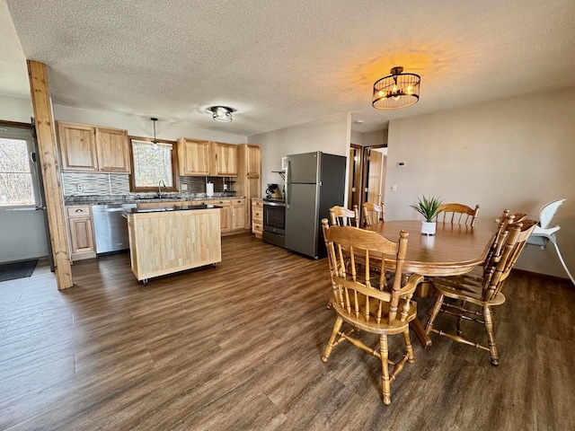 28887 Hi Vista Dr, Otter Tail Twp, MN 56515 - dining space featuring dark wood-style floors, a textured ceiling, and a chandelier