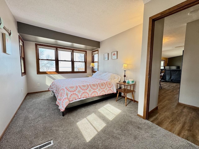 28887 Hi Vista Dr, Otter Tail Twp, MN 56515 - carpeted bedroom with a textured ceiling and baseboards