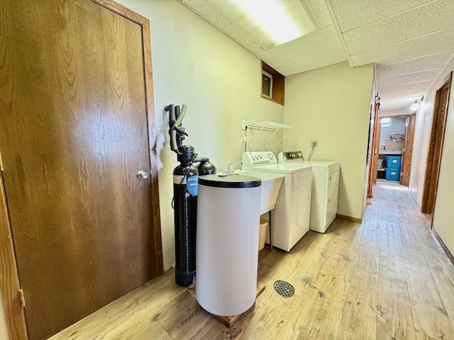 28887 Hi Vista Dr, Otter Tail Twp, MN 56515 - laundry room with washer and dryer and light wood-style flooring