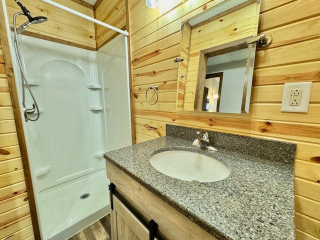 28887 Hi Vista Dr, Otter Tail Twp, MN 56515 - bathroom with wooden walls, a shower stall, and vanity